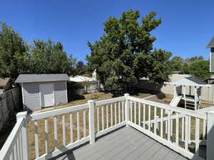 Trex deck with a shed and a fenced backyard