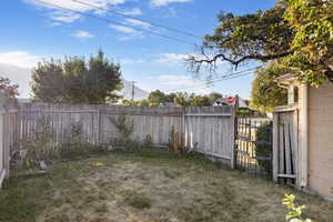 View of fenced backyard