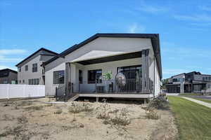 Back of house with a porch