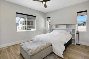 Bedroom with wood finished floors and ceiling fan