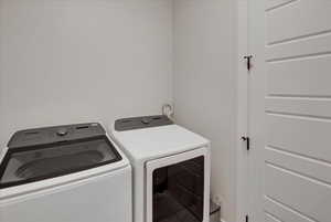 Laundry room featuring washing machine and clothes dryer