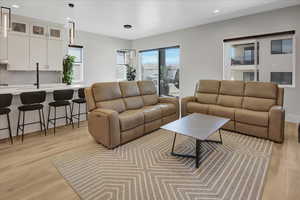 Living room featuring recessed lighting and light wood-type flooring