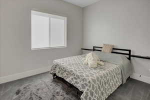 Carpeted bedroom with baseboards