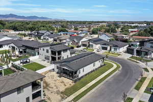Aerial view of residential area with a mountainous background