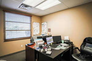 Office space featuring a drop ceiling