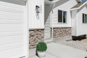 Entrance to property with a garage