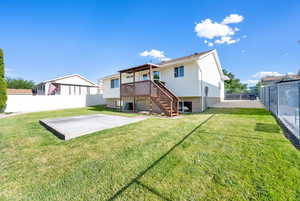 Back of house featuring a patio, a fenced backyard, and stairway