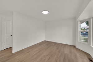 Bonus room featuring light wood-style floors