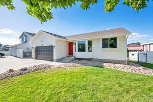 Ranch-style home with an attached garage and concrete driveway