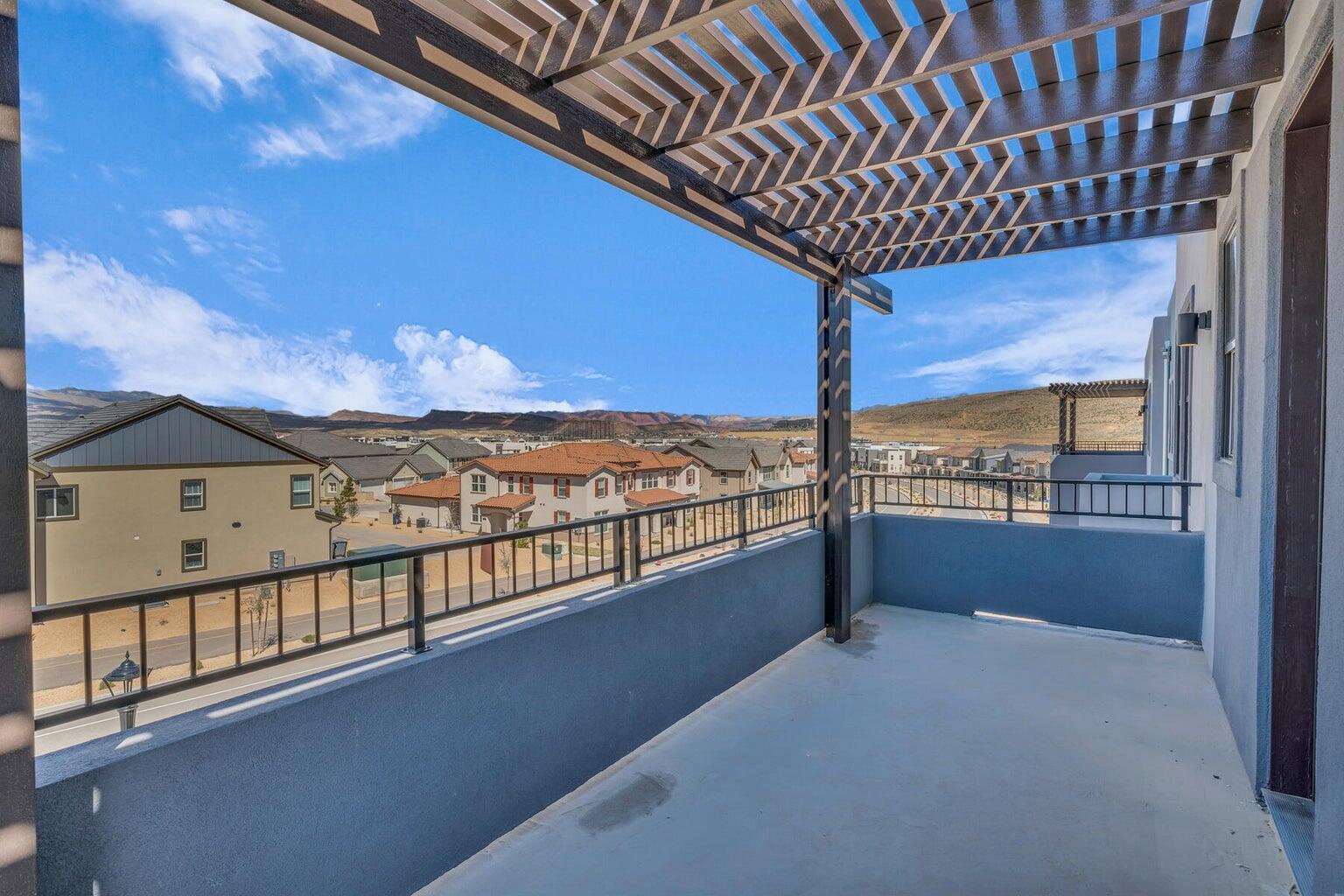 Balcony with a pergola and a residential view