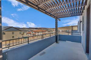Balcony with a pergola and a residential view