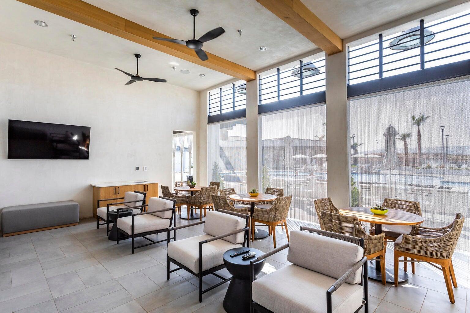 Lobby featuring beam ceiling and a high ceiling
