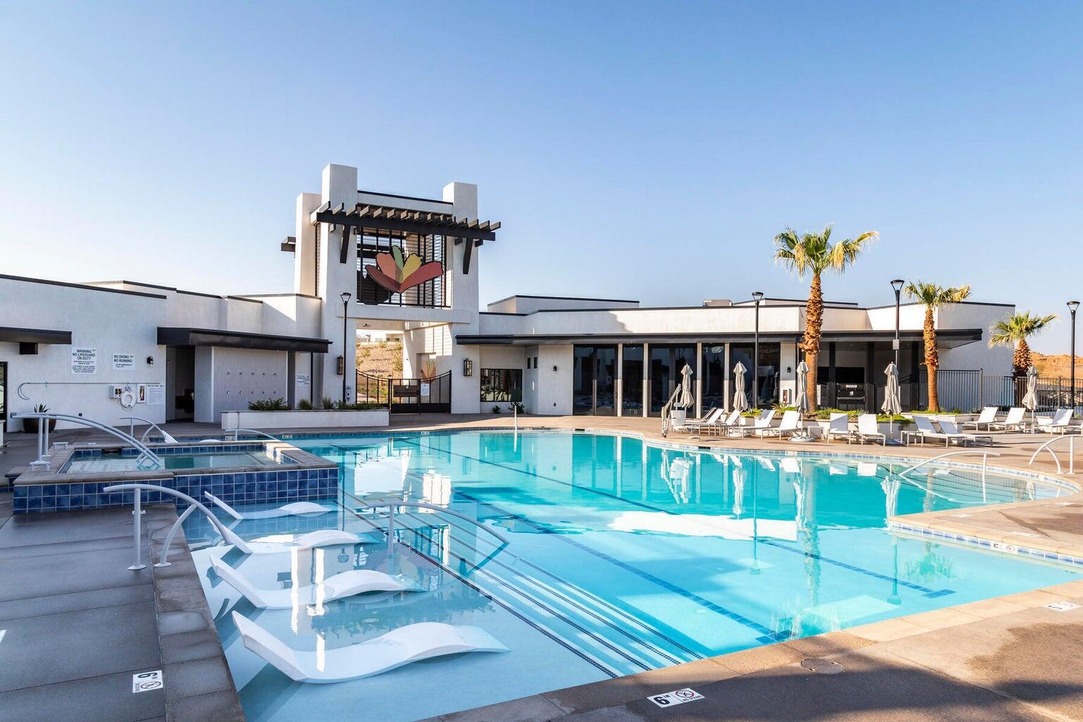 Community pool with a hot tub and a patio