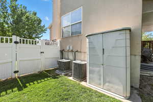 View of home's exterior with a gate and stucco siding