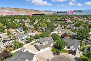 Aerial perspective of suburban area featuring a mountainous background