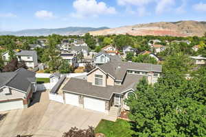 Aerial perspective of suburban area featuring a mountainous background