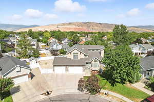 Aerial perspective of suburban area with a mountain backdrop