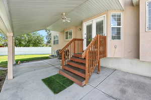 View of patio featuring ceiling fan