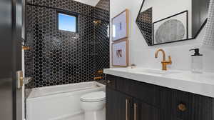 Bathroom featuring vanity and shower / bathtub combination