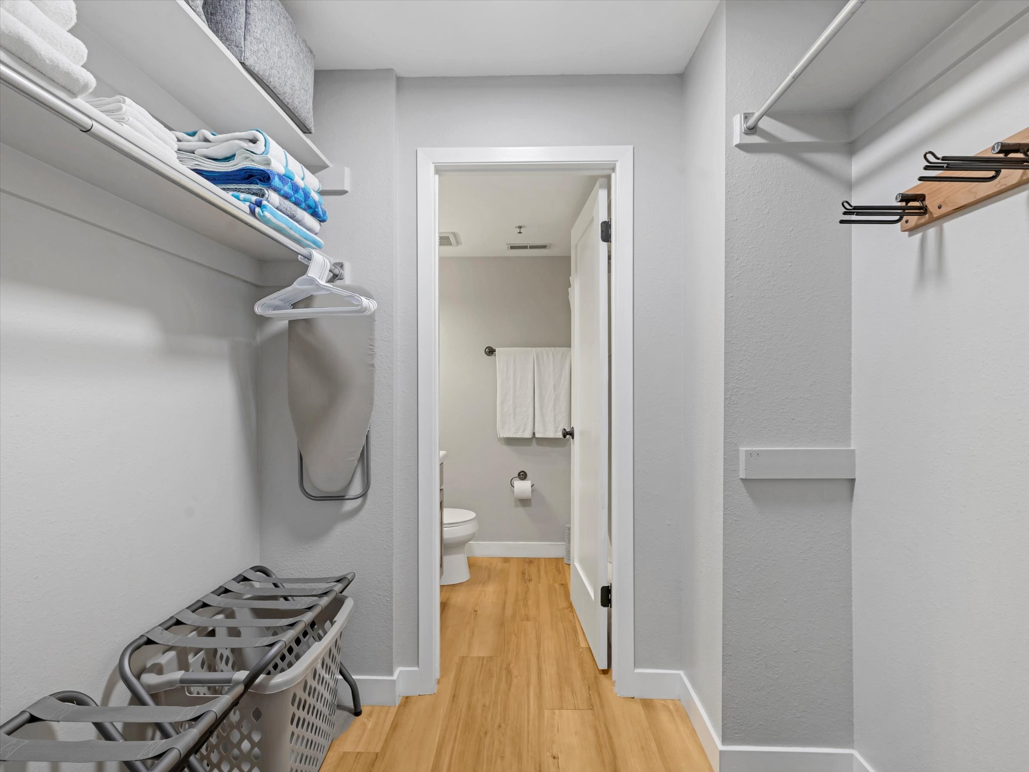 Spacious closet with light wood-style flooring