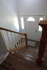 Foyer entrance featuring hardwood / wood-style flooring and stairway