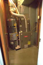 Utilities featuring water heater and heating unit