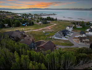 Aerial view at dusk of a water view and a residential view