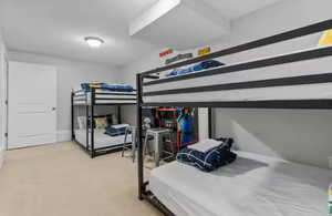 Carpeted bedroom with baseboards