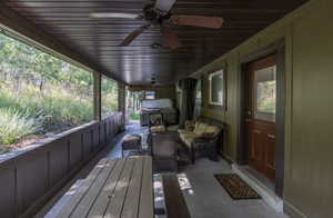 Deck with a ceiling fan, outdoor lounge area, and grilling area