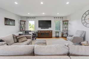 Living area featuring healthy amount of natural light, recessed lighting, and wood finished floors