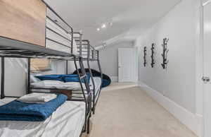 Bedroom with carpet floors and baseboards