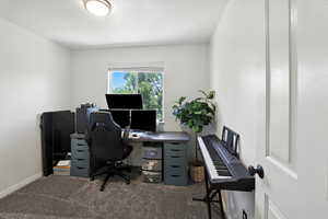 Carpeted office with baseboards