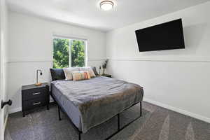 Carpeted bedroom with baseboards