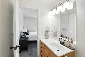 Bathroom with vanity and ensuite bath