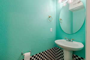 Bathroom featuring a textured wall