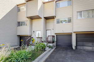 Exterior space featuring an attached garage and driveway