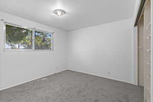 Unfurnished bedroom featuring carpet floors