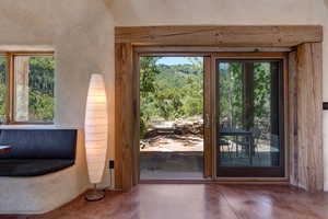 Doorway to outside with finished concrete floors
