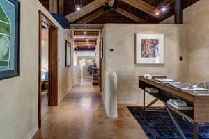 Home office with concrete flooring and wood ceiling