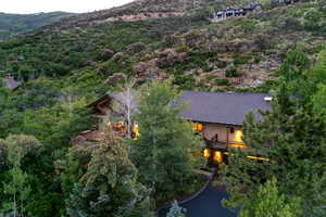 Aerial view of the house with a mountainous background