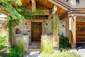 Doorway to property featuring stunning stone