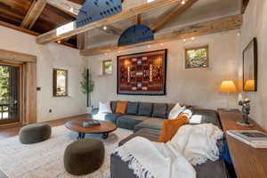Living area featuring beam ceiling