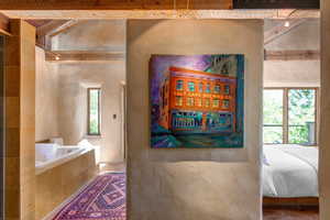 Full bath with sandstone tile and countertops