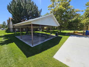 View of community featuring a gazebo, a lawn, and a patio area