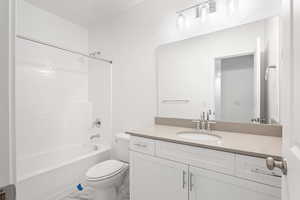 Bathroom with vanity, shower / tub combination, and marble finish floors