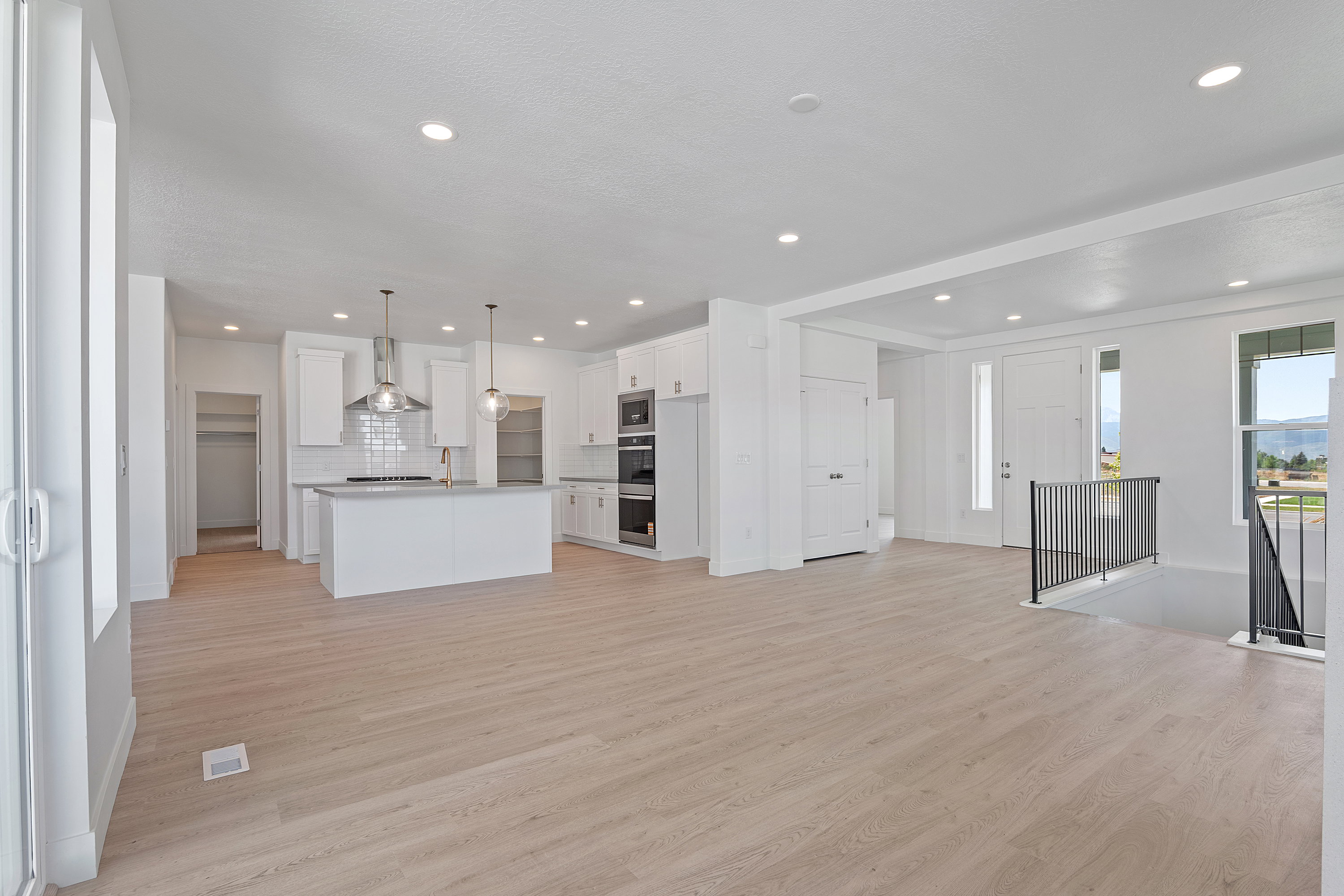 Unfurnished living room featuring light wood-style flooring and recessed lighting