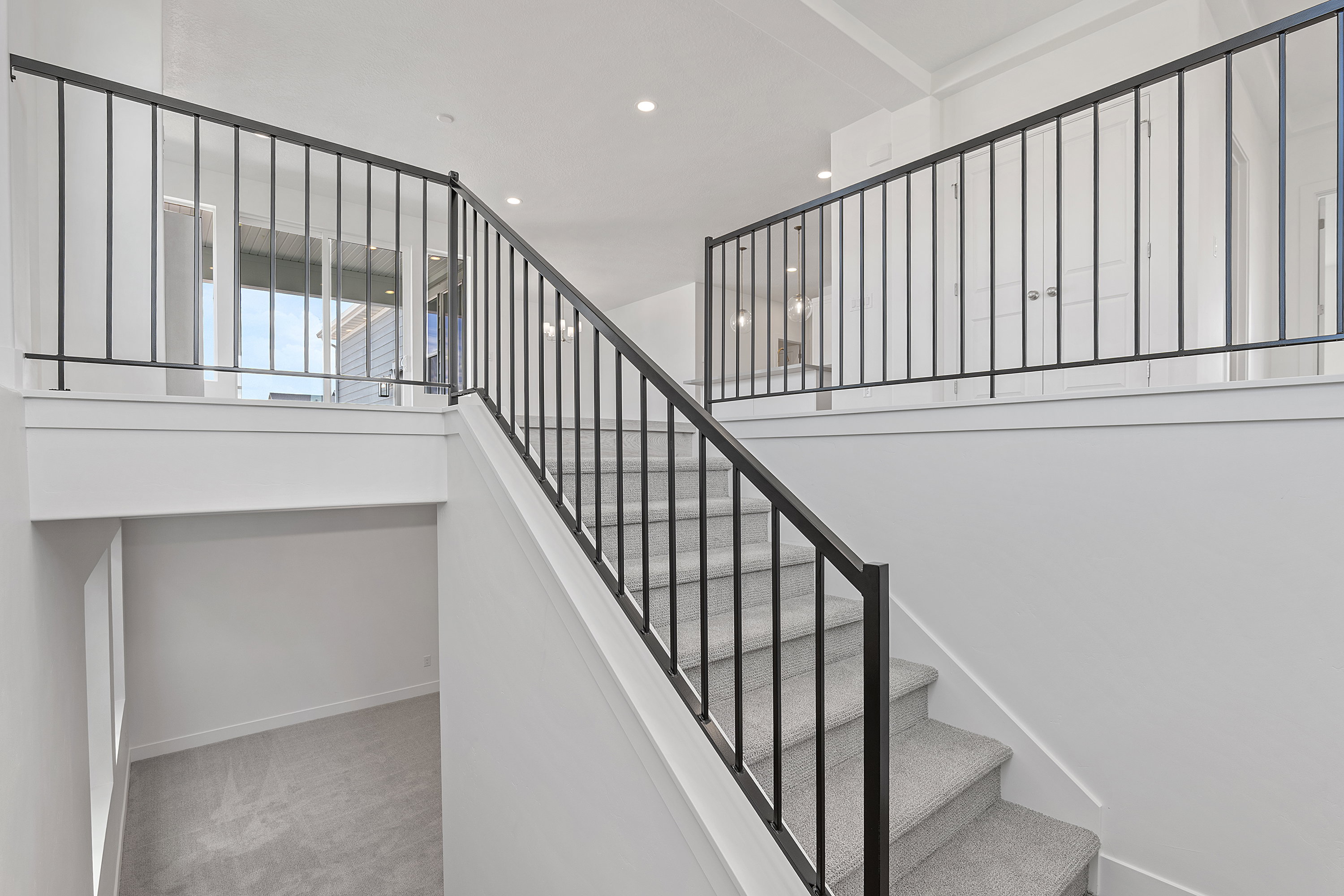 Staircase featuring carpet and recessed lighting