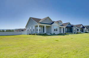 Light blue siding exterior with white trim and a covered front porch