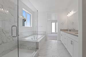 Full bath with marble look tile flooring, a bath, double vanity, a marble finish shower, and french doors