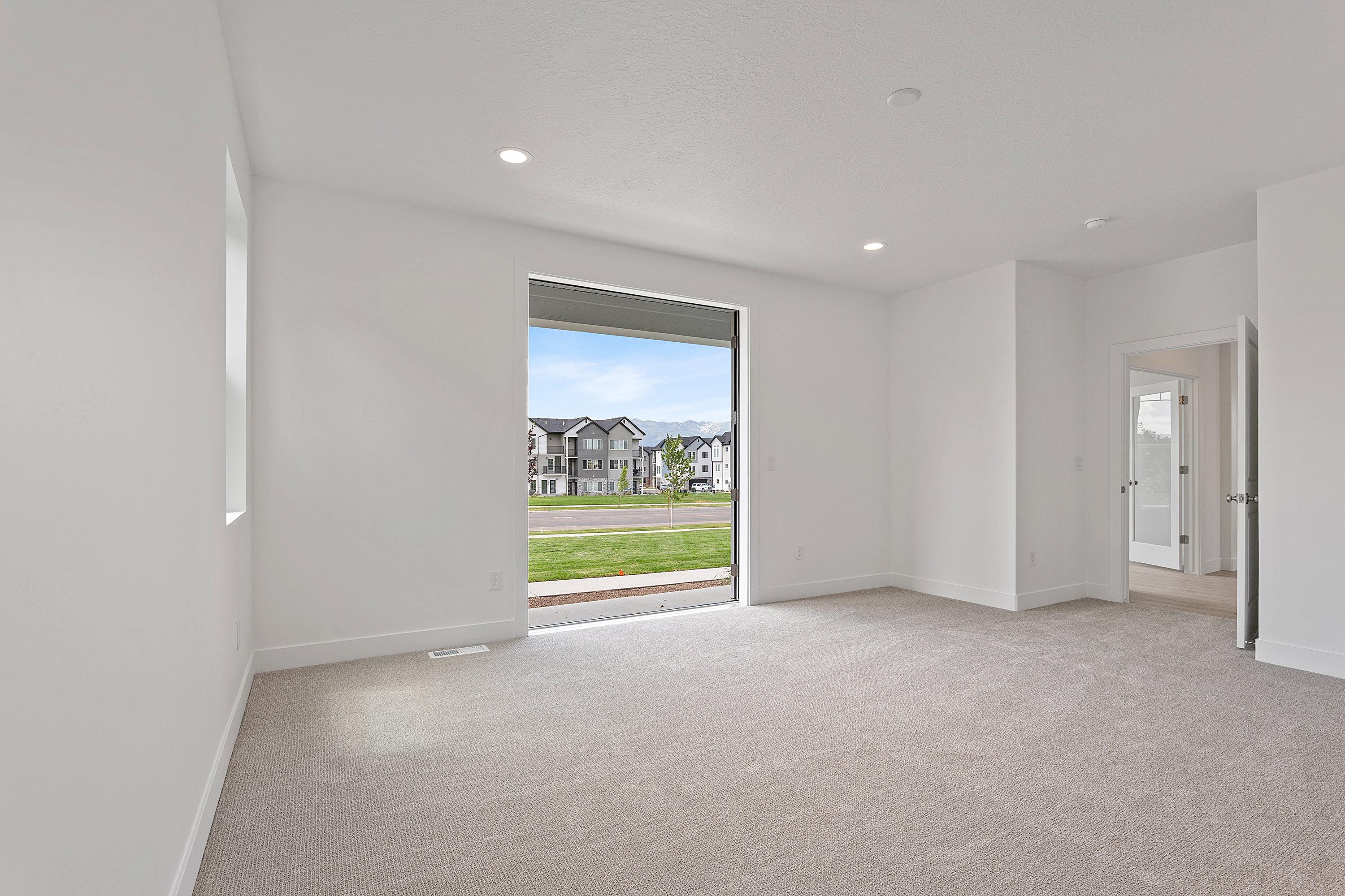 Unfurnished room featuring light colored carpet and recessed lighting